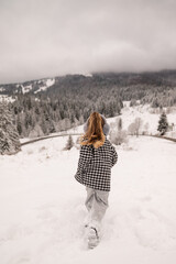 Little girl playing in snow