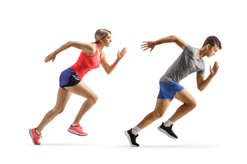 Full length profile shot of a fit young man and woman running fast