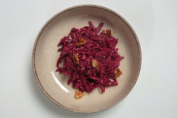 The image shows a bowl of beet salad.