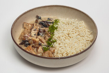 The image shows a bowl containing a savory dish. 