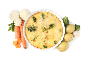 Delicious vegetable casserole and ingredients isolated on white, top view