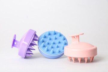 Hair scalp massagers on grey background