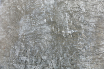 Textured gray concrete surface with subtle white patterns