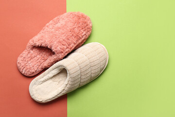 Pair of different slippers on colorful background. Top view