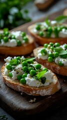 Delicious open-faced sandwiches topped with fresh green peas and creamy cheese displayed on a wooden board