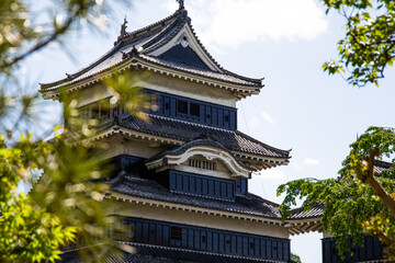 A towering castle from the samurai era, in Japan.