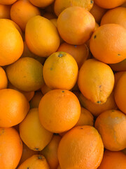 Close-up of Bahia oranges, highlighting the peel texture and vibrant color. Ideal for projects on citrus fruits, culinary, and fresh food.