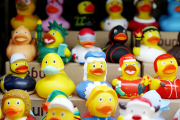 Colorful toys.Many colorful rubber duck toys in various outfits on sale. Rubber ducks are a popular toy around the world