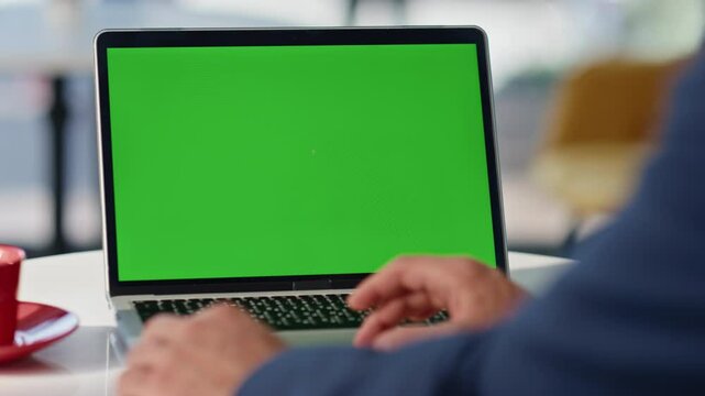 Manager swiping touchpad mockup laptop online sitting light restaurant closeup