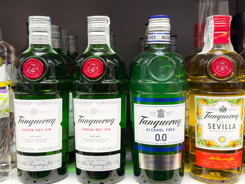 Assorted bottles of tanqueray gin including alcohol-free options