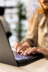 Confident general manager in business attire multitasking at her workplace, juggles email, project...