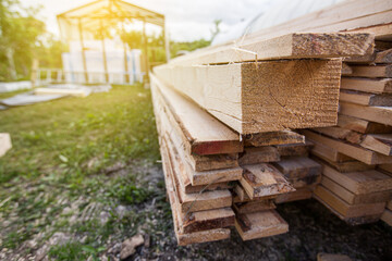 Wooden planks and timbers stacked in pile
