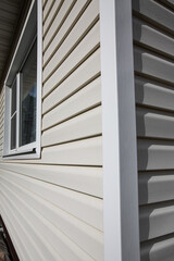 Obraz premium The corner of a house made with siding planks