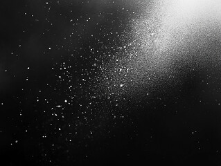 Obraz premium Abstract representation of scattered particles against a dark background, evoking a sense of depth and movement