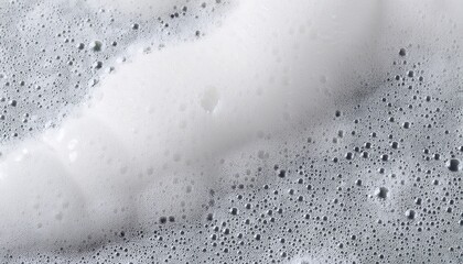 texture of white soap foam with bubbles abstract background