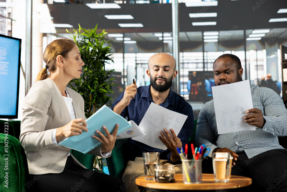 Poster manager with employees developing and implementing business strategies to improve operational effici