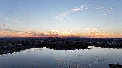 Obraz premium Aerial view of orange sunset over the lake