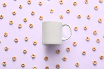 Ceramic mug and cereals on white background. Top view