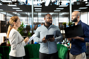 Manager enjoying chat in office, building and maintaining strong relationships with key clients, suppliers and business partners. Company director managing relationships with partners
