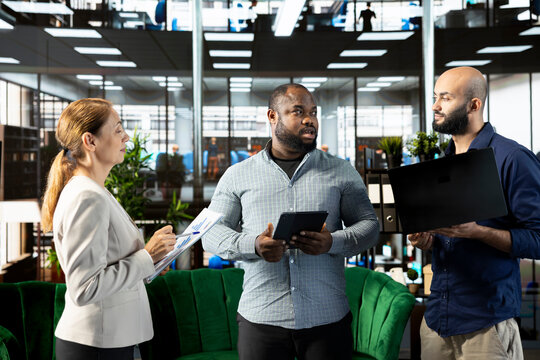 Manager enjoying chat in office, building and maintaining strong relationships with key clients, suppliers and business partners. Company director managing relationships with partners