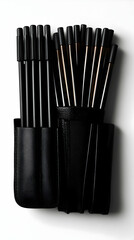 Stylish Black Leather Pen Case with Black and Brown Pens - Product Photography