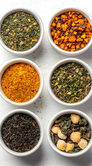 Variety of Dried Tea Leaves and Spices in Bowls - Photo