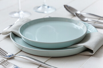 Beautiful table setting on white background. Closeup
