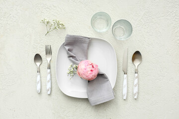 Beautiful table setting with peony flower on white background. Top view