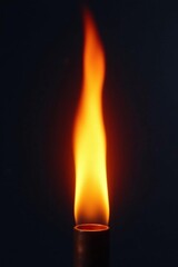 Isolated flame column bursting forth from a fiery nozzle tip, bright, flames