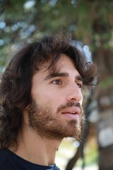 Long Hair Man Astonished To Read An Incomprehensible Poster On The Street