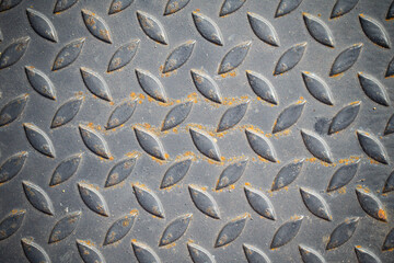 Patterned steel surface and rust.
