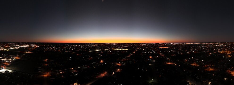 Orange sunset at nightfall over the city