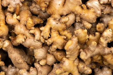 Fresh ginger roots in the traditional Colombian market - Zingiber officinale