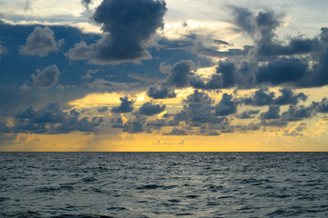 Obraz premium Dramatic sky background. Dark stormy cloudy sky. Sunset seascape with dramatic sky. Cloudy sky over sea.