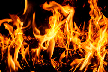Fire flames on black background. Fire sparks background. Abstract dark fire flames background. Background of flames blazing.