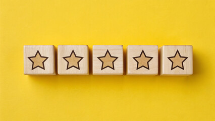 Customer satisfaction feedback and rating concept. Five wooden blocks, aligned on top with star ratings on yellow background, customer feedback, satisfaction survey, and service evaluation