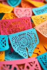 Fototapeta premium Vibrant papel picado banners in a mix of colors and patterns.