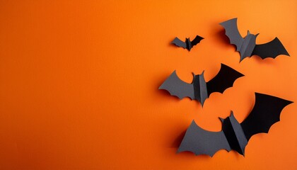 Naklejka premium halloween diy decorations halloween party greeting card mockup with cardboard bats on orange background with copy space generative ai