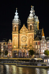Fototapeta premium Beautiful aerial view of Amsterdam Stichting Muziek in de Nicolaas near the Centraal Train Station and its historic hub with canals, bikes, cafes. Netherlands 