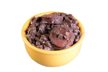 delicious Brazilian feijoada with farofa rice salad served in bowl over piece of wood on blurred background, Brazilian food