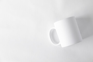 One blank mug on white background, top view. Mockup for design