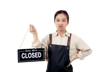 Portrait young asian barista woman wearing apron holding closed sign with unhappiness, waitress...