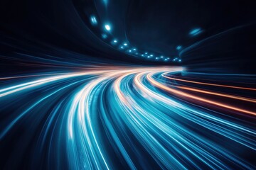 Vibrant light trails in a tunnel showcase the speed of vehicles. Blue and orange hues contrast against the dark background, evoking a sense of energy and motion in technology and transportation.