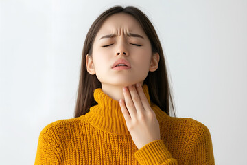 Asian girl with neck pain. Concept of sore throat, pharyngitis, laryngitis, thyroiditis, choking