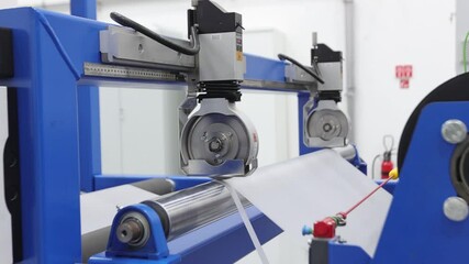 Worker preparing plastic grains for EVA film at extrusion machine