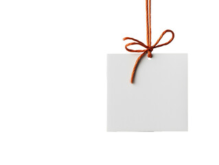 A blank gift card suspended by a knotted red rope against a clean white backdrop, ideal for adding a festive touch to your holiday decorations.