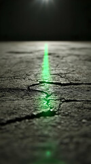 Obraz premium Green laser on cracked surface