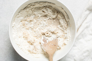 Overhead view of hot cross bun dough being mixed, process of making hot cross buns