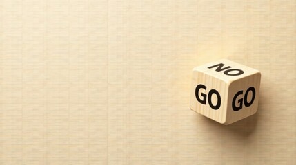 A wooden cube displaying the words go and no, representing a critical decision