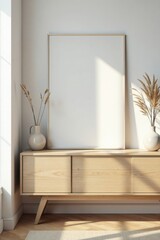 Light-filled interior design showcasing a minimalist wooden sideboard with a blank canvas, complemented by dried floral arrangements in simple vases.